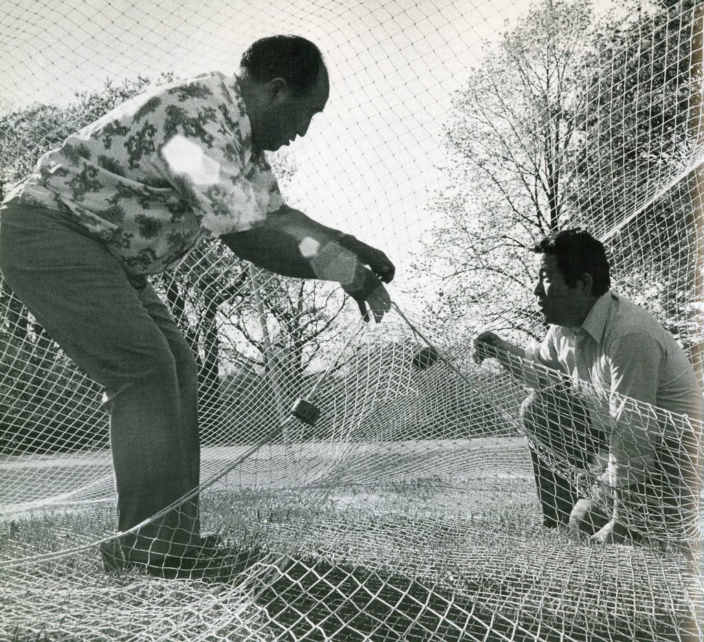 Sun Myung Moon teaches a student how to make a net at UTS